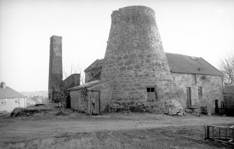 View from NW showing tower with WNW and NNE fronts of mill block
