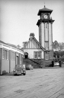 View from SSW showing SSW front of clock tower and part of station building