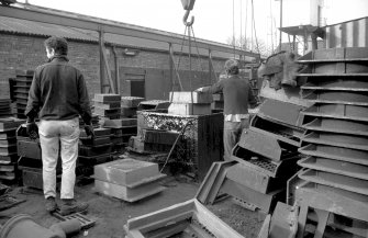 View from ESE showing men dipping road castings