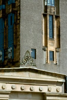 Digital image of Grecian roof detail with School of Art behind.