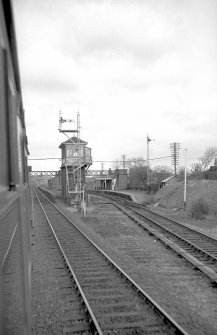 View from S showing SSE and WSW fronts of signal box with station buildings and footbridge in background