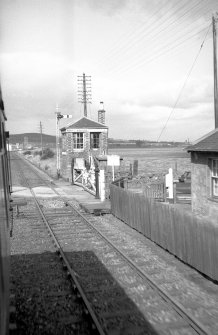 View from SSE showing level crossing and SE and SW fronts of signal box
