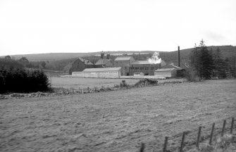 General view from NNE showing ENE and NNW fronts of distillery buildings