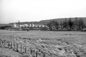 General view from WNW showing WSW and NNW fronts of distillery buildings