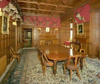 Interior. Ground floor view of dining room from West showing original furnishings, fittings and stags heads installed for the Earls of Fife looking through the smoking room, entrance hall and into the drawing room
Digital image of D/11007/cn