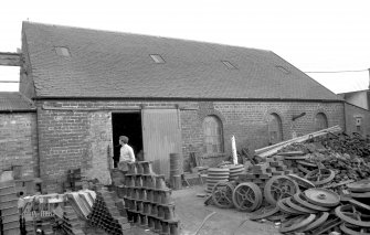 View from W showing WSW front of store and machine shop