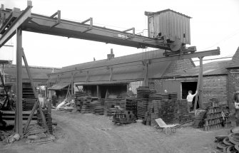 View from SSW showing stockyard and travelling crane