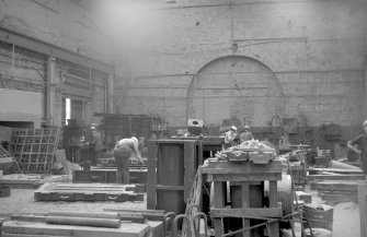 Interior
View showing men working in old bay