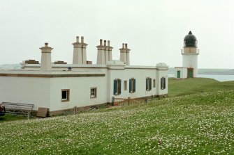 View from SW of S side of keeper's house, and lighthouse tower in distance.
Digital image of D 11478 CN.