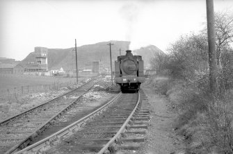 View from SSE showing NCB locomotive 060T no 9 departing colliery
