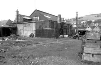 View from S showing SSW and ESE fronts of main block