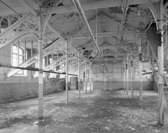 Interior.
View of cast-iron roof trusses and columns with gothic shaped wooden infills central section on top floor of main building.
Digital image of A 38494