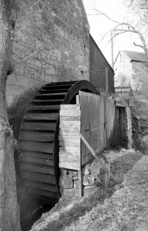 View from E showing waterwheel on NNE front