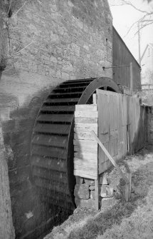 View from E showing waterwheel on NNE front