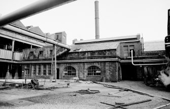 View from WNW showing NW fronts of exhauster house (L) and liquor pump house (R)