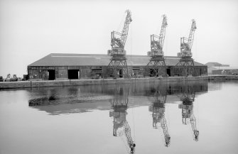 View from SW showing cranes on N side of Leith Docks, Edinburgh.