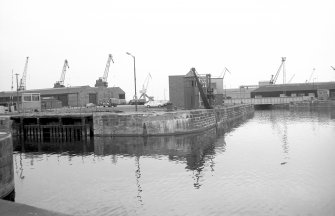 View from S showing crane and part of N lock gate at entrance to Albert Dock