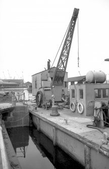 View from SE showing barge Grab no 1 and crane