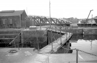 View from NNE showing dry dock gates with NNW front of bridge in background