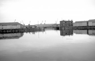 View from SSW showing entrance to dock with SSW and WNW fronts of watch house in right background