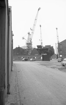 View from SE (possible) showing works buildings and cranes