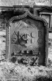 View of the gravestone of a barber, 1777.