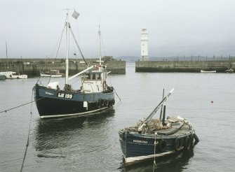 View from ESE showing fishing boats in harbour and lighthouse, Newhaven, Edinburgh