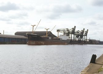 General view from ENE showing transporter ship with cranes in background