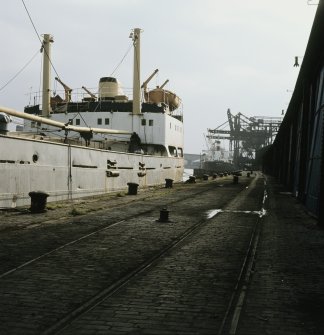 View from W showing ships moored on quay