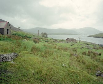 General view of whaling station from N, showing (left to right) Pig House (extreme left), boiler-house chimney (distant left), laboratory, and byre built from brick salvaged from demolished chimney (right)
Digital image of C 68879 CN