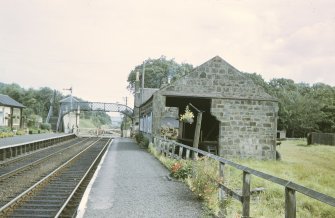 View from SW showing SW front of goods shed with footbridge in background