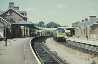 General view from SSE showing Glasgow - Carlisle train at station