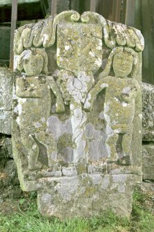 View of gravestone of the McNaughton children, depicting Adam and Eve.
Digital image of C 14970/cn