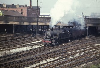 View from E showing locomotive shunting parcel vans in sidings