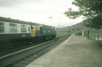 View from NE showing Inverness - Kyle of Lochalsh train in station