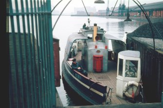 View from ESE showing Kelvinhaugh 'Wee' ferry docked at Kelvinhaugh Wharf