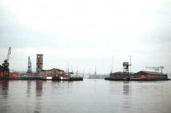 General view from W showing entrance to dock with hydraulic power station to the left