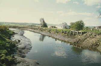 View from N showing canal with NNW and ENE fronts of house in background
