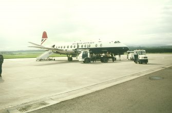 View from NW (possible) showing British Airways Viscount aircraft on tarmac outside terminal