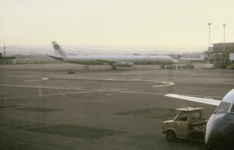 View from SSE showing DC8 aircraft on tarmac outside terminal