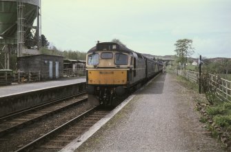 View from E showing type 26 locomotive of Oban - Glasgow train entering station