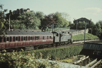View from S showing locomotive 42170 with train approaching station