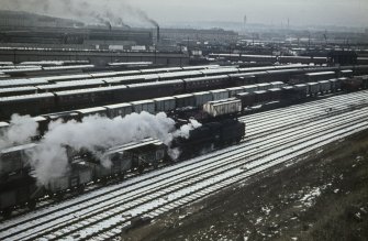 General view from E showing carriages and stock-wagons with cleaning shed in middle background and works in background