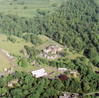 Scanned image of oblique aerial view of Newbattle Abbey, garden, sundials and military camp, taken from the N.