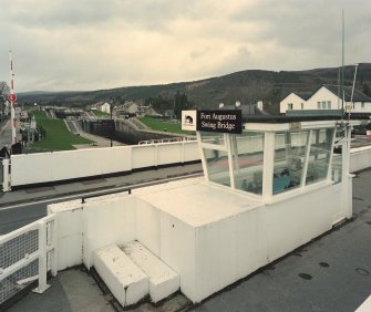 Fort Augustus, Swing Bridge over Caledonian Canal
An elevated view looking west past the control cabin and towards the stair of canal locks beyond
Digital image of D 64038 CN