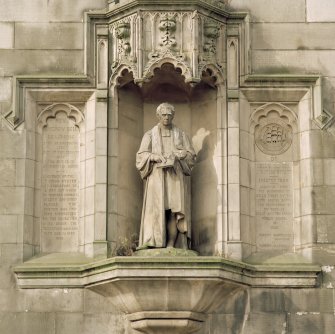 Detail of statue of Dr. Bell flanked by inscribed panels, Great Junction Street, Edinburgh.
