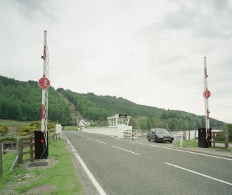 Laggan, Swing Bridge over Caledonian Canal
View from south looking along deck of bridge, with barriers in foreground, and control cabin (centre)
Digital image of D 48280 CN
