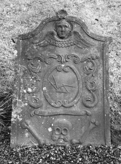 Forgandenny Parish Churchyard.
General view of the gravestone commemorating Alexander Robertson, 1783. Winged soul, panel with plough, 'Memento Mori' ribbon, skull and two bones.
Digital image of A 37034 PO