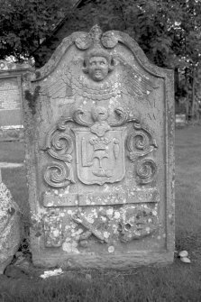 Logierait Parish Church.
General view of gravestone of Duncan McPherson 1794. Winged soul over armorial panel with the tools of a shoemaker and crown of the Hammermen's guild, hourglass, crossed bones and skull.
Digital image of PT 15097.