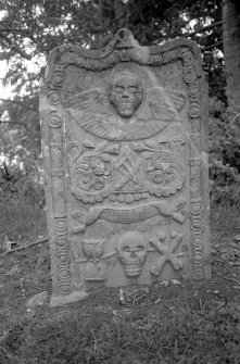 Logierait Parish Church.
General view of gravestone commemorating Margaret McIntosh, 1800. Winged Soul over sock and coulter of the plough, arrow of death, hourglass, skull and crossed bones, linked by a thread of life.
Digital image of PT 15099.